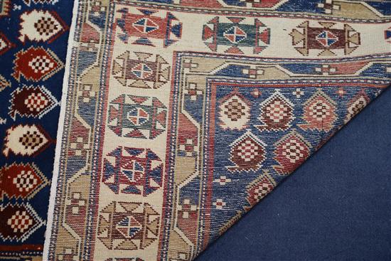 A Caucasian blue ground prayer rug, 4ft 10in by 3ft 5in.